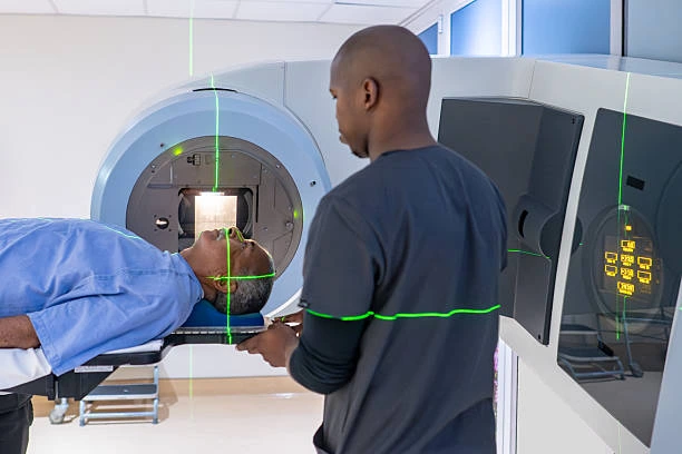 Radiology services in Jamaica showing a patient undergoing a CT scan procedure with a radiology technician operating the imaging machine.